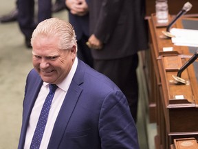 Ontario Premier Doug Ford leaves the Queens Park Legislative Chamber after the PC Provincial Government introduced "The Efficient Local Government Act" at the Ontario Legislature in Toronto, on Wednesday September 12, 2018.