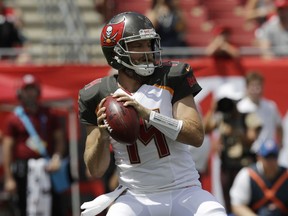 Tampa Bay Buccaneers quarterback Ryan Fitzpatrick (14) looks to pass,during the first half of an NFL football against the Philadelphia Eagles, Sunday, Sept. 16, 2018, in Tampa, Fla.