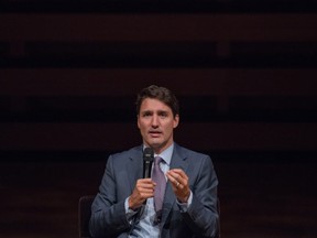 Prime Minister Justin Trudeau participates in an armchair discussion with Christine Lagarde, managing director of the International Monetary Fund, moderated by journalist Katie Couric, at the Women in the World Summit in Toronto on Monday, September 10, 2018.