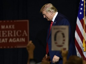 U.S. President Donald Trump walks off of the stage following a fundraiser in Sioux Falls, S.D., Friday, Sept. 7, 2018.