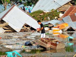 A man surveys the damage caused by earthquake and tsunami in Palu, Indonesia, Sept. 29, 2018.