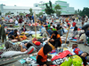 Medical workers help patients outside a hospital after an earthquake and a tsunami hit Palu, on Sulawesi Island on Sept. 29, 2018.