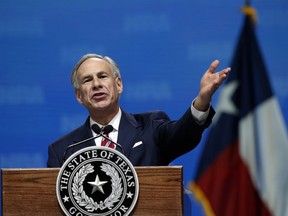 FILE - In this May 4, 2018, file photo, Gov. Greg Abbott speaks at the National Rifle Association-Institute for Legislative Action Leadership Forum in Dallas. Abbott will face Democratic challenger Lupe Valdez in their only debate on Friday night, Sept. 28, 2018. Valdez is the former sheriff of Dallas County and would become Texas' first Hispanic and openly gay governor if elected.