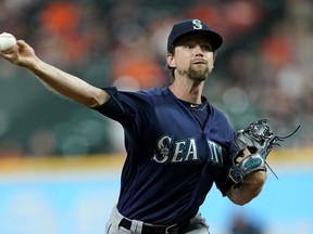 Seattle Mariners starting pitcher Mike Leake throws against the Houston Astros during the first inning of a baseball game Tuesday, Sept. 18, 2018, in Houston.