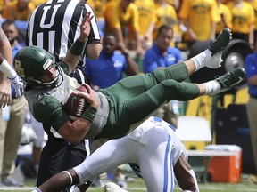 Baylor quarterback Charlie Brewer (12) is tackled by Duke safety Dylan Singleton (16) in the first half of an NCAA college football game, Saturday, Sept. 15, 2018, in Waco, Texas.