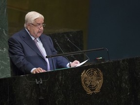 CORRECTS NAME OF SYRIAN DEPUTY PRIME MINISTER TO WALID AL-MOALLEM -  Syrian Deputy Prime Minister Walid al-Moallem addresses the 73rd session of the United Nations General Assembly, Saturday, Sept. 29, 2018 at U.N. headquarters.