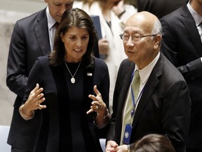 U.S. Ambassador Nikki Haley, left, talks with Japan's Ambassador Koro Bessho in the United Nations Security Council, Monday, Sept. 17, 2018, at U.N. headquarters.