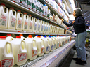 A shopper checks out the milk selection at a store in Montpelier, Vermont.