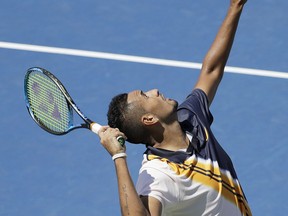 Nick Kyrgios, of Australia, serves to Pierre-Hugues Herbert, of France, during the second round of the U.S. Open tennis tournament, Thursday, Aug. 30, 2018, in New York.
