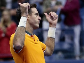 Juan Martin del Potro, of Argentina, reacts to fans after Rafael Nadal, of Spain, retired from a match during the semifinals of the U.S. Open tennis tournament, Friday, Sept. 7, 2018, in New York.