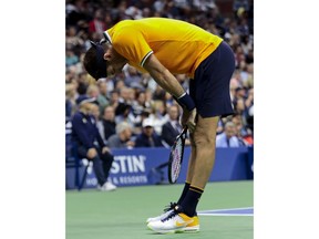 Juan Martin del Potro, of Argentina, bends over pauses between serves during the men's final of the U.S. Open tennis tournament against Novak Djokovic, of Serbia, Sunday, Sept. 9, 2018, in New York.