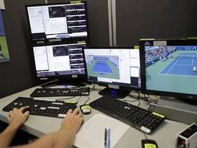 Jack Pesterfield monitors a match from a seat in the review office during the third round of the U.S. Open tennis tournament, Saturday, Sept. 1, 2018, in New York.