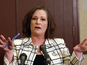 FILE - In this April 5, 2018, file photo, McKenna Denson speaks with reporters during a news conference in Salt Lake City. Denson, a woman who sued a former Mormon missionary leader claiming that he raped her in the 1980s, went to his congregation in Arizona and said church leaders are covering for a "sexual predator."