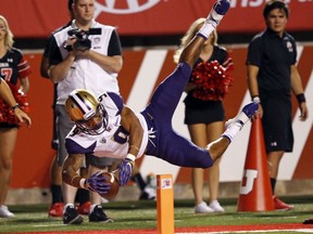 Washington running back Myles Gaskin (9) scores against Utah in the first half during an NCAA college football game, Saturday, Sept. 15, 2018, in Salt Lake City.