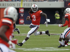 Virginia quarterback Bryce Perkins (3) runs with the ball against Louisville during the first half of an NCAA college football game Saturday, Sept. 22, 2018, in Charlottesville, Va.