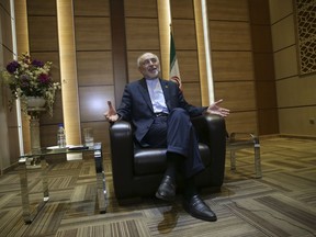 Iran's nuclear chief Ali Akbar Salehi speaks in an interview with The Associated Press at the headquarters of Iran's atomic energy agency, in Tehran, Iran, Tuesday, Sept. 11, 2018. Salehi told The Associated Press that he hopes the atomic deal between Tehran and world powers survives, but warns the program will be in a stronger position than ever if not.