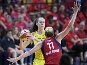 Seattle Storm forward Breanna Stewart, back, holds the ball against Washington Mystics forward Elena Delle Donne (11) during the first half of Game 3 of the WNBA basketball finals, Wednesday, Sept. 12, 2018, in Fairfax, Va.