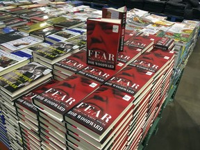 Copies of Bob Woodward's "Fear" are seen for sale at Costco, Wednesday, Sept. 11, 2018 in Arlington, Va. It's not clear whether President Donald Trump has much to fear from "Fear" itself. But the book of that name has set off a yes-no war between author Bob Woodward and the president, using all the assets they can muster.