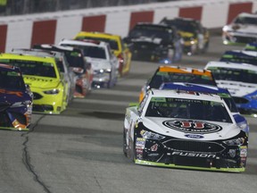 Kevin Harvick (4) leads the field at the start of the NASCAR Cup Series auto race at Richmond Raceway in Richmond, Va., Saturday, Sept. 22, 2018.