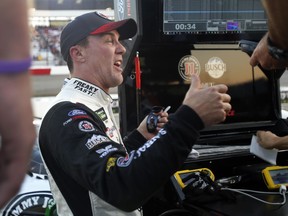 Kevin Harvick gives his crew a thumbs-up after qualifying for Saturday's NASCAR Cup Series auto race at Richmond Raceway in Richmond, Va., Friday, Sept. 21, 2018. Harvick won the pole.