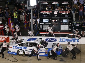 Brad Keselowski (2) drives into the pit during the NASCAR Monster Energy Series auto race at Richmond Raceway in Richmond, Va., Saturday, Sept. 22, 2018.