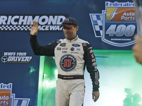 Kevin Harvick waves to the crowd during driver introductions prior to the start of the NASCAR Cup Series auto race at Richmond Raceway in Richmond, Va., Saturday, Sept. 22, 2018.