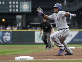 Texas Rangers' Adrian Beltre reacts as he tries to get back to first base on an unassisted double play off a ball hit by Rangers' Joey Gallo during the second inning of a baseball game against the Seattle Mariners, Sunday, Sept. 30, 2018, in Seattle. Beltre was out on the play.
