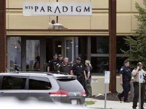 Emergency personnel are on the scene of a shooting at a software company in Middleton, Wis., Wednesday, Sept. 19, 2018.    Four people were shot and wounded during the shooting in the suburb of Madison, according to a city administrator.
