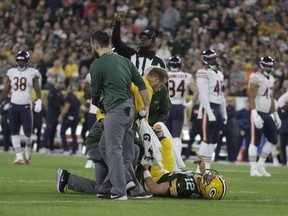 Green Bay Packers quarterback Aaron Rodgers is hurt after being sacked during the first half of an NFL football game against the Chicago Bears Sunday, Sept. 9, 2018, in Green Bay, Wis.