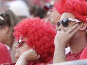 Wisconsin fans watch during the second half of an NCAA college football game against BYU Saturday, Sept. 15, 2018, in Madison, Wis. BYU won 24-21.