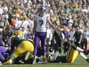 Minnesota Vikings kicker Daniel Carlson reacts after missing a field goal in the final sends of overtime an NFL football game against the Green Bay Packers Sunday, Sept. 16, 2018, in Green Bay, Wis. The game ended in a 29-29 tie.
