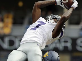 Kansas State wide receiver Isaiah Zuber (7) makes a catch while being defended by West Virginia cornerback Hakeem Bailey (24) during the first half of an NCAA college football game, Saturday, Sept. 22, 2018, in Morgantown, W.Va.