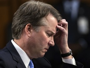 In this Sept. 6, 2018 photo, Supreme Court nominee, Brett Kavanaugh waits to testify before the Senate Judiciary Committee for the third day of his confirmation hearing, on Capitol Hill in Washington.  Official Washington is scrambling Monday to assess and manage Kavanaugh's prospects after his accuser, Christine Blasey Ford, revealed her identity to The Washington Post and described an encounter she believes was attempted rape. Kavanaugh reported to the White House amid the upheaval, but there was no immediate word on why or whether he had been summoned.