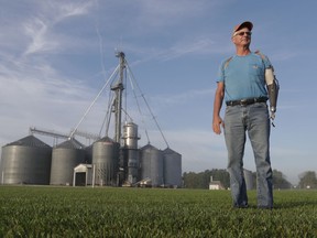 Jack Maloney poses in front of the grain bins on his Little Ireland Farms in Brownsburg, Ind., Wednesday, Sept. 12, 2018. Maloney, who farms about 2,000 acres in Hendricks Count, said the aid for farmers is "a nice gesture" but what farmers really want is free trade, not government handouts. American farmers will soon begin getting checks from the government as part of a billion-dollar bailout to help those experiencing financial strain from President Donald Trump's trade disputes with China