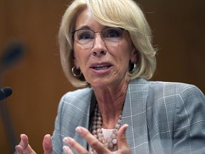 FILE - In this June 5, 2018, file photo, Education Secretary Betsy DeVos testifies during hearing on the FY19 budget on Capitol Hill in Washington. A federal court has ruled that a decision by DeVos to delay an Obama-era rule meant to protect students swindled by for-profit colleges was "arbitrary and capricious," dealing a significant blow to the Trump administration's attempt to ease regulations for the industry.