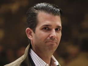 FILE - In this Nov. 16, 2016 file photo, Donald Trump Jr., walks from the elevator at Trump Tower in New York. President Donald Trump's eldest son on Monday appeared to mock the sexual assault allegations against his father's nominee for the Supreme Court. Donald Trump Jr. posted an image on Instagram that seems to compares Kavanaugh's accuser to a school yard crush.