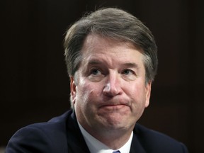 In this Sept. 6, 2018 photo, Supreme Court nominee Brett Kavanaugh reacts as he testifies after questioning before the Senate Judiciary Committee on Capitol Hill in Washington. Official Washington is scrambling Monday to assess and manage Kavanaugh's prospects after his accuser, Christine Blasey Ford, revealed her identity to The Washington Post and described an encounter she believes was attempted rape. Kavanaugh reported to the White House amid the upheaval, but there was no immediate word on why or whether he had been summoned.