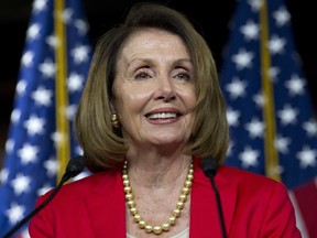 FILE - In this Sept. 6, 2018, file photo, House Minority Leader Nancy Pelosi, D-Calif., speaks during her weekly news conference on Capitol Hill in Washington. Consumer and health care groups say they're trying to block a move by the pharmaceutical industry to commandeer must-pass opioids epidemic legislation as a vehicle for rolling back drugmaker discounts to Medicare beneficiaries with high prescription costs. Republican leaders were saying little about behind-the-scenes discussions on Sept. 21,, but a spokesman for Pelosi calls it a "a multi-billion dollar handout to Big Pharma."