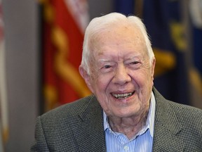 FILE - In this April 11, 2018 file photo, former President Jimmy Carter, 93, sits for an interview before a book signing in Atlanta. Carter is cautioning Democrats that their path to defeating President Donald Trump depends on independents and moderates. Carter says that U.S. policies on immigration, the environment and human rights will not improve while Trump is in office and that many independents are souring on the current president.