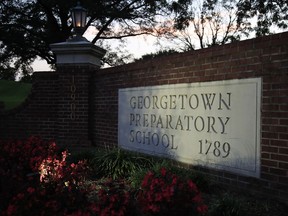 The entrance to the Georgetown Preparatory School Bethesda, Md., is shown, Wednesday, Sept. 19, 2018. Mark Judge spent decades mining his recollections and writing books and articles full of semi-confessional details about the suburban Maryland prep school he attended with future Supreme Court nominee Brett Kavanaugh. Now, though, Judge's memory has drawn a blank.