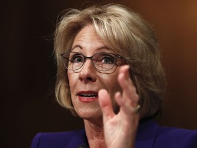 FIlE - In this Jan. 17, 2017, file photo, then-Education Secretary-designate Betsy DeVos testifies on Capitol Hill in Washington, at her confirmation hearing before the Senate Health, Education, Labor and Pensions Committee.