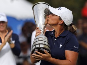 Angela Stanford of the U.S. poses with her trophy after winning the Evian Championship women's golf tournament in Evian, eastern France, Sunday, Sept. 16, 2018.