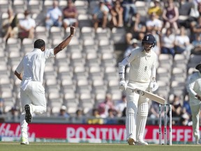 England's Stuart Broad edges the ball and is caught behind first ball off the bowling of India's Mohammed Shami, who celebrates, left, during play on the fourth day of the 4th cricket test match between England and India at the Ageas Bowl in Southampton, England, Sunday, Sept. 2, 2018. England and India are playing a 5 test series.