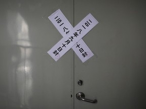 Official seal notices are sticked on a backdoor entrance of the Zion church after it was shutdown by authoritiwa in Beijing, Tuesday, Sept. 11, 2018. China is rolling out new rules on religious activity on the internet amid an ongoing crackdown on churches, mosques and other institutions by the officially atheist Communist Party. Anyone wishing to provide religious instruction or similar services online must apply by name and be judged morally fit and politically reliable, according to draft regulations posted online late Monday by the State Administration for Religious Affairs.