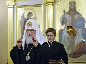 In this handout photo released by Russian Orthodox Church Press Service, Russian Orthodox Church Patriarch Kirill presides over a meeting of the church's Holy Synod of the Russian Orthodox Church, in Moscow, Russia, Friday, Sept. 14, 2018. The meeting of the Russian Orthodox Church's top hierarchs mulled a response to a decision by Orthodox Christianity's leading body to send two envoys to Ukraine.