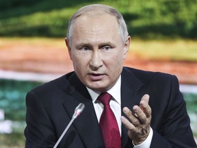 Russian President Vladimir Putin gestures as he addresses at the Eastern Economic Forum in Vladivostok, Russia, Wednesday, Sept. 12, 2018.