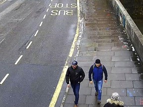 FILE In this file grab taken from CCTV and issued by the Metropolitan Police in London on Wednesday Sept. 5, 2018, Ruslan Boshirov and Alexander Petrov walk on Fisherton Road, Salisbury, England on March 4, 2018. President Vladimir Putin said on Wednesday, Sept. 12, 2018 that Russia has identified the two men that Britain named as suspects in the poisoning of a former Russian spy, and that there is "nothing criminal" about them.