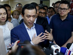 Philippine opposition Sen. Antonio Trillanes IV gestures during a hastily-called news conference at the Philippines Senate Tuesday, Sept. 4, 2018 in suburban Pasay city, south of Manila, Philippines. President Rodrigo Duterte voided an amnesty given to the former rebel military officer and ordered the arrest of the man who as a senator has been one of the president's fiercest critics.