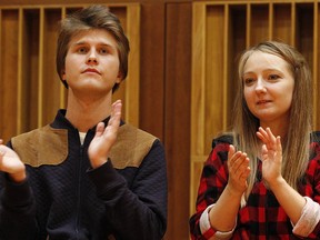 Aleksandra Swigut, right, applauds Tomasz Ritter, left, of Poland who is declared the winner of the 1st Chopin Competition on Period Instruments in Warsaw, Poland, Thursday, Sept. 13, 2018.  The announcement took place after each of the six finalists played a Chopin concerto accompanied by the Amsterdam-based Orchestra of the 18th century.