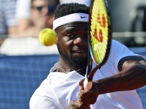 Frances Tiafoe of the United States returns a shot to Croatia's Borna Coric during their Davis Cup semifinal singles match between Croatia and the United States in Zadar, Croatia, Sunday, Sept. 16, 2018.